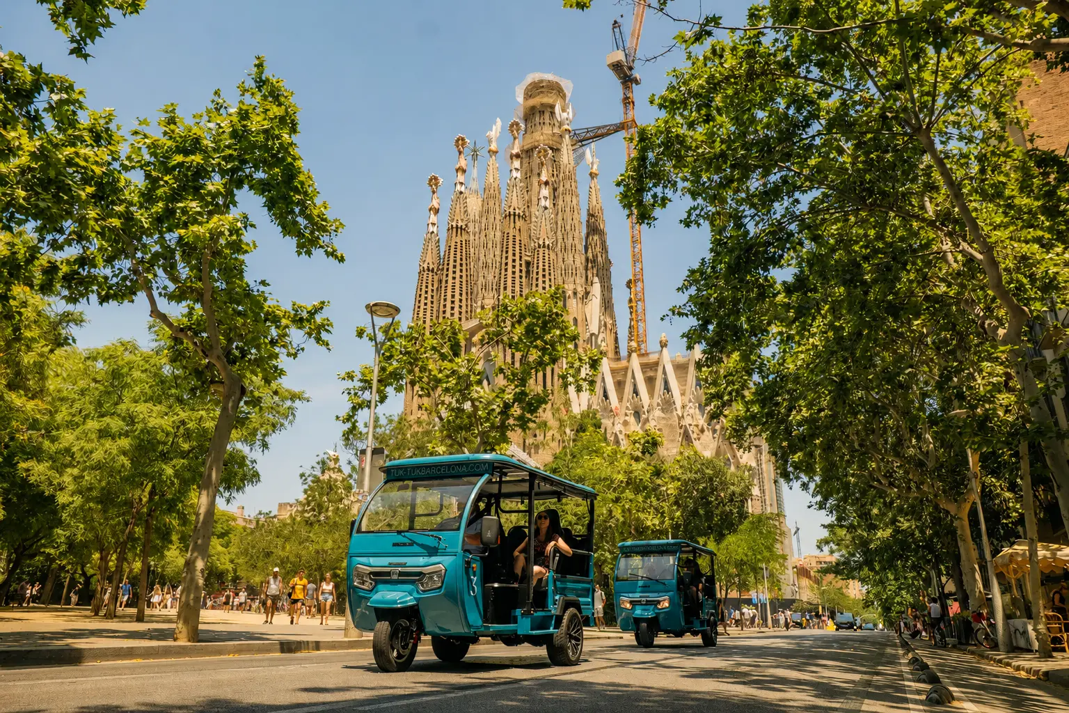 Electric Tuk Tuks in front of the Sagrada Família